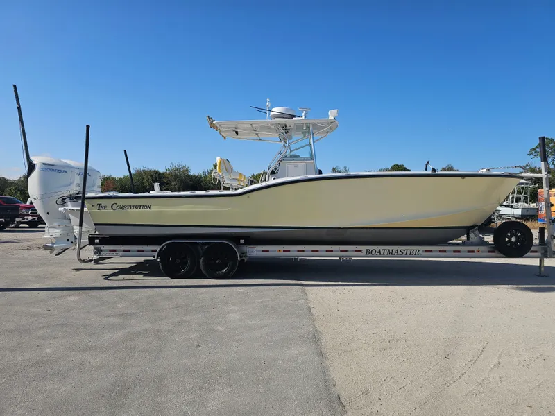 The Image of 1987 Ocean Master 31 boat on trailer, side view. - 0