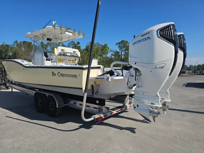 Slide: The Image of 1987 Ocean Master 31 boat with Honda engines on trailer. - 2