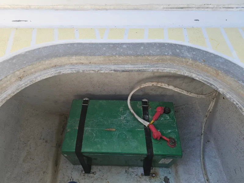 Slide: The Image of Boat battery in storage compartment of a 1987 Ocean Master 31. - 30