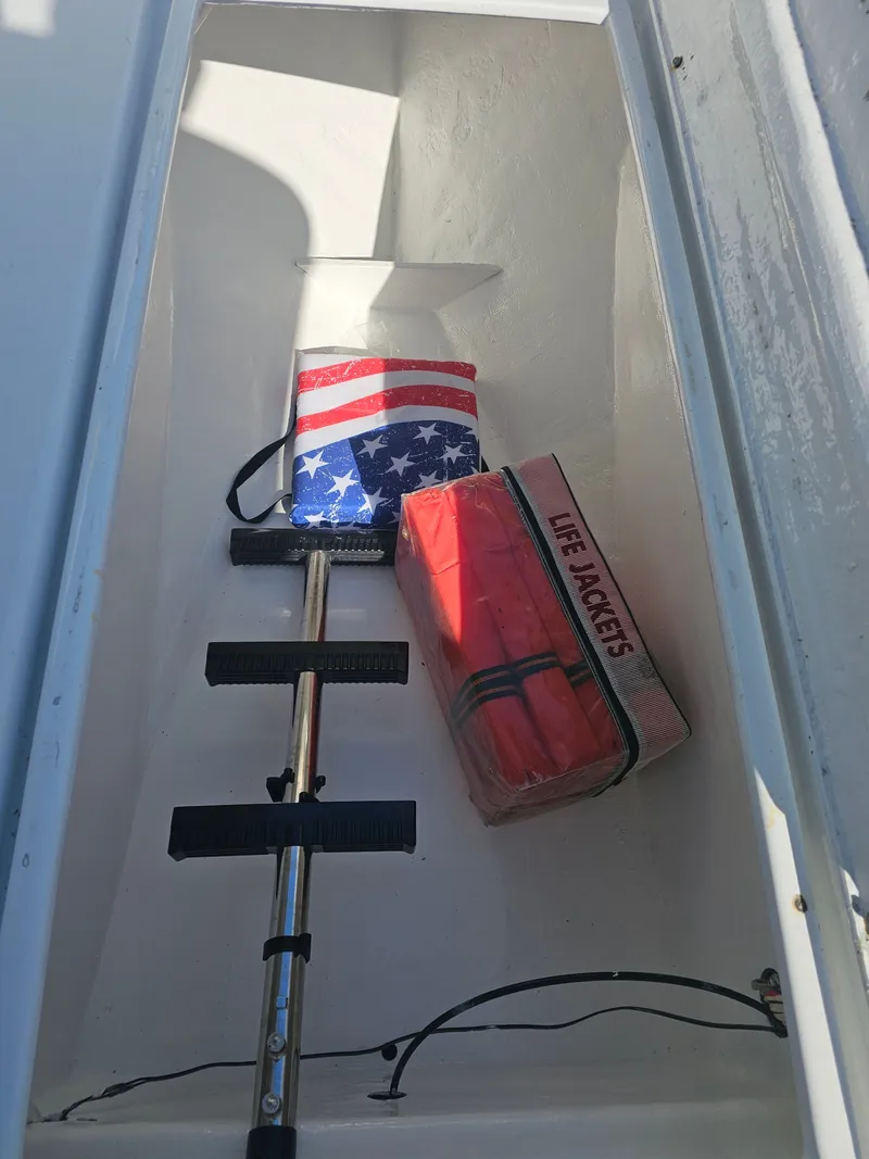 Slide: The Image of Boat storage with ladder and life jackets, Ocean Master 31, 1987. - 32