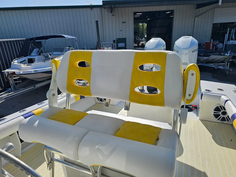 Slide: The Image of Interior of a 1987 Ocean Master 31 boat with yellow and white seating. - 48
