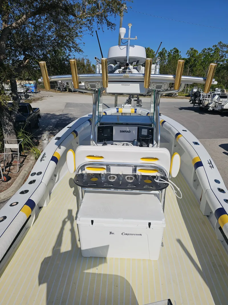 Slide: The Image of 1987 Ocean Master 31 boat with modern equipment and fishing rod holders. - 5
