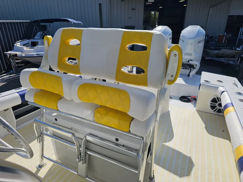 Slide: The Image of 1987 Ocean Master 31 boat with yellow and white seating. - 7