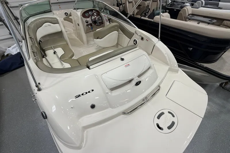 Slide: The Image of 2006 Sea Ray 200 Sundeck boat interior with seating and dashboard. - 5