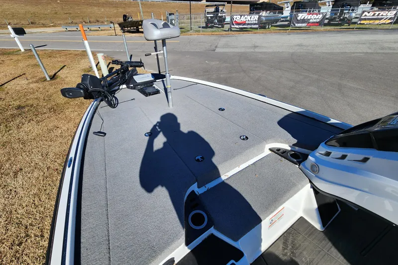 Slide: The Image of 2023 Nitro Z20 boat deck with fishing equipment and shadow on a sunny day. - 7