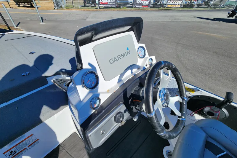 Slide: The Image of 2023 Nitro Z20 boat dashboard with Garmin display and steering wheel. - 8