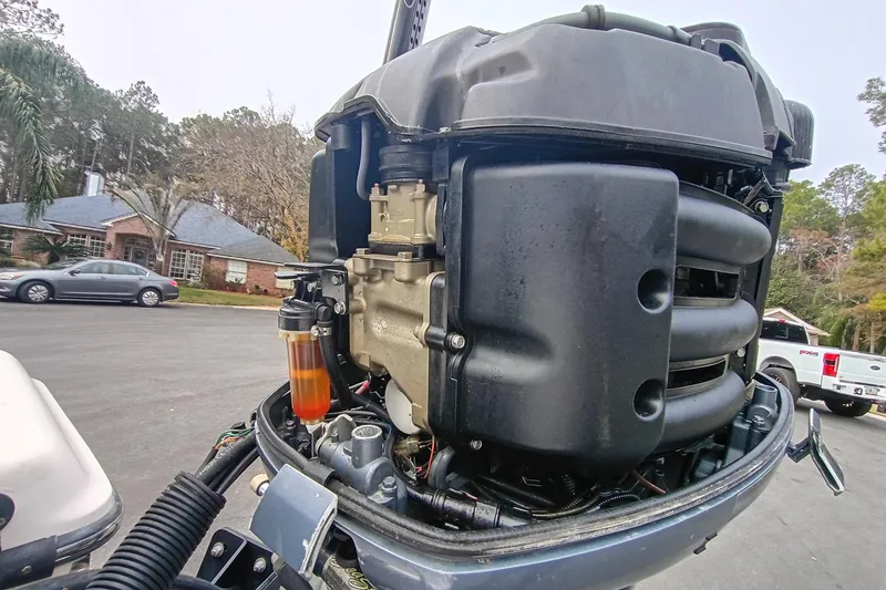 Slide: The Image of 2006 ShearWater Z2200 outboard motor close-up with visible fuel filter. - 13