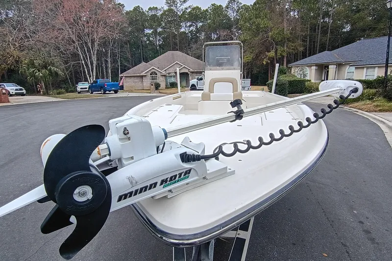 Slide: The Image of 2006 ShearWater Z2200 boat with Minn Kota trolling motor in residential area. - 14