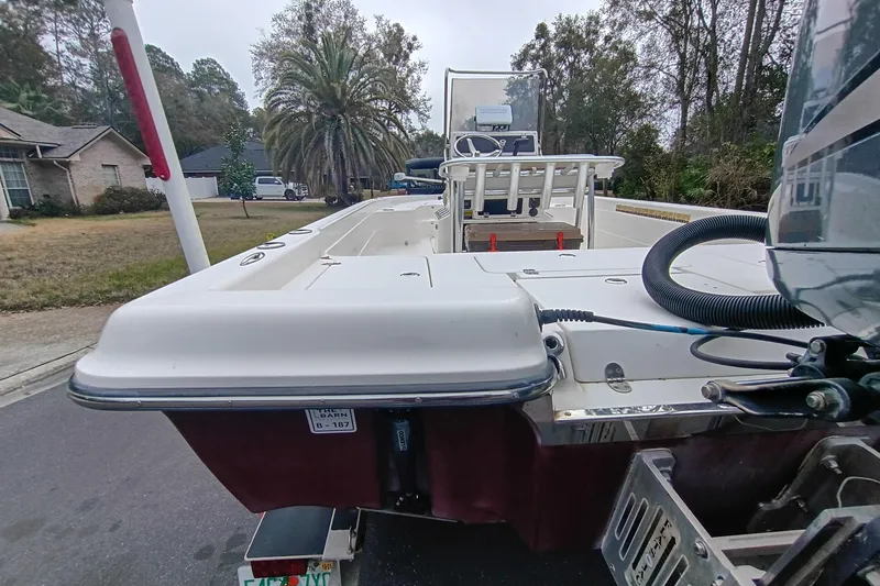 Slide: The Image of 2006 ShearWater Z2200 boat on trailer, parked in suburban neighborhood. - 21