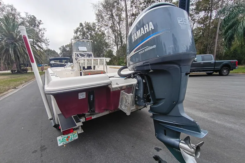 Slide: The Image of 2006 ShearWater Z2200 boat with Yamaha 250 outboard motor on a road. - 22