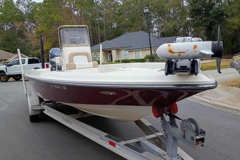 Slide: The Image of 2006 ShearWater Z2200 boat on trailer, parked in residential area. - 26