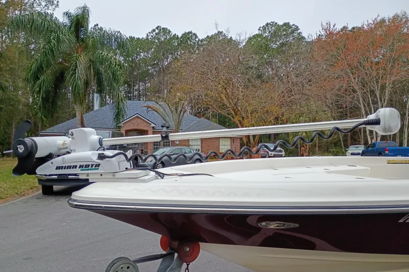 Slide: The Image of 2006 ShearWater Z2200 boat with Minn Kota trolling motor in a suburban neighborhood. - 28