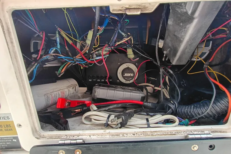 Slide: The Image of Electrical wiring and components inside a 2006 ShearWater Z2200 boat compartment. - 3