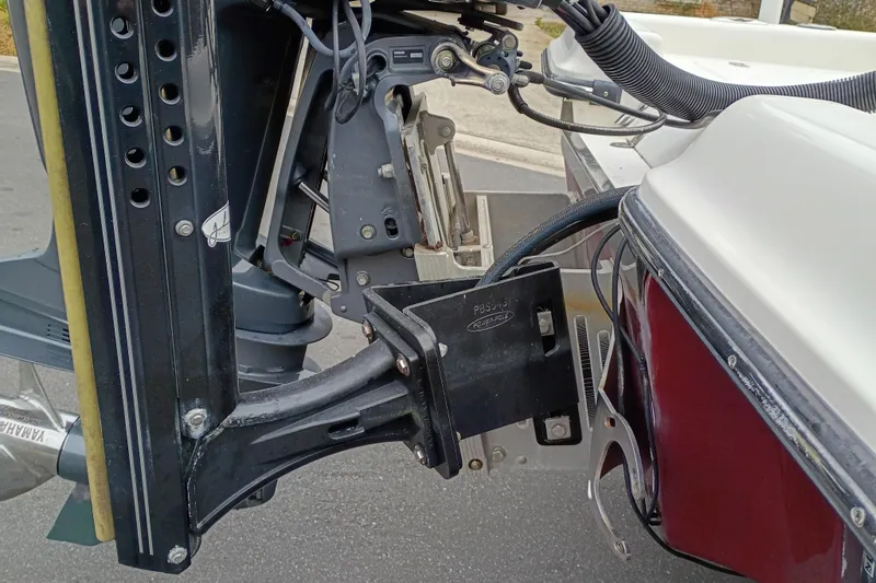 Slide: The Image of Close-up of a 2006 ShearWater Z2200 boat motor mount and components. - 31