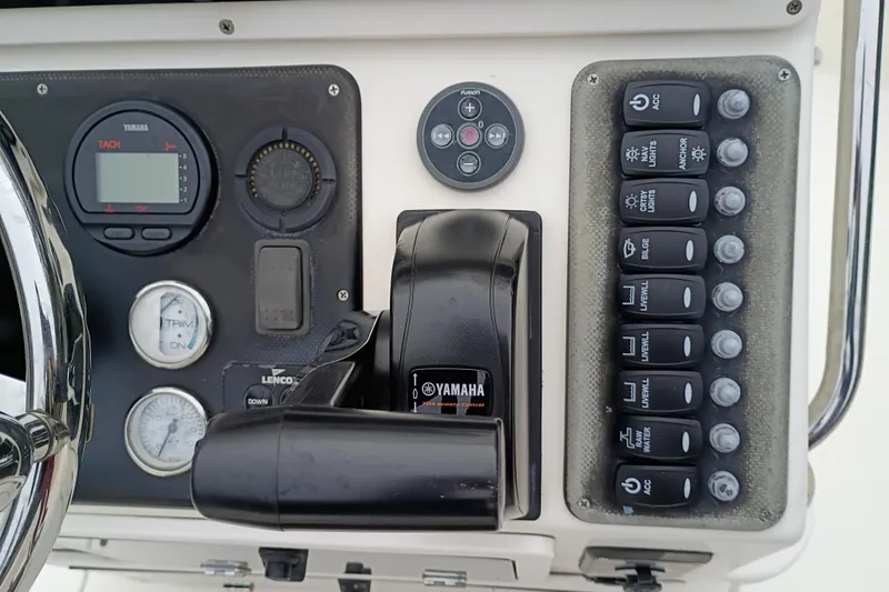 Slide: The Image of Control panel of 2006 ShearWater Z2200 boat with Yamaha throttle and gauges. - 33