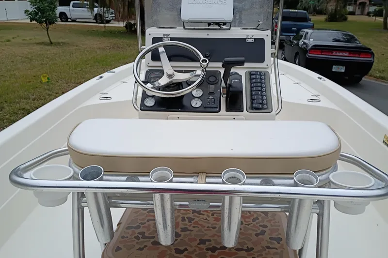 Slide: The Image of 2006 ShearWater Z2200 boat console with steering wheel and control panel. - 34
