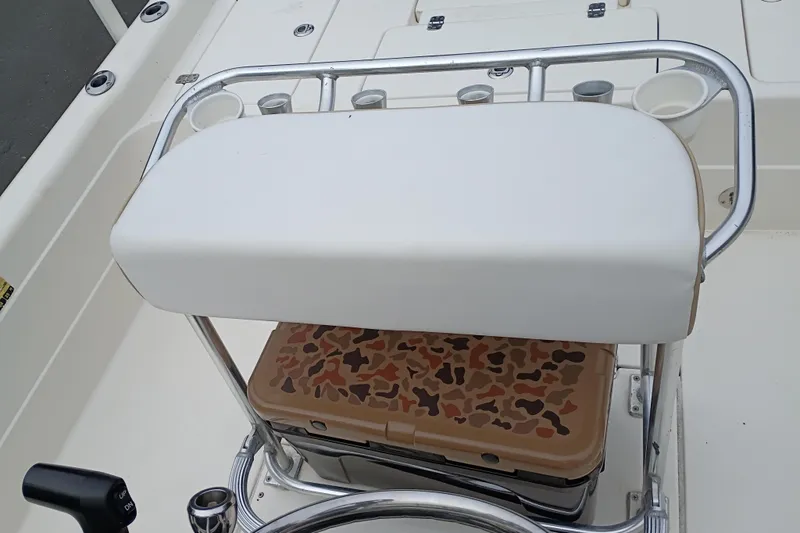 Slide: The Image of 2006 ShearWater Z2200 boat seat with rod holders and camouflage cooler. - 37