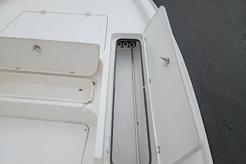 Slide: The Image of Open storage compartments on a 2006 ShearWater Z2200 boat deck. - 39