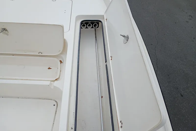 Slide: The Image of Open storage compartment on a 2006 ShearWater Z2200 boat, showing interior details. - 40