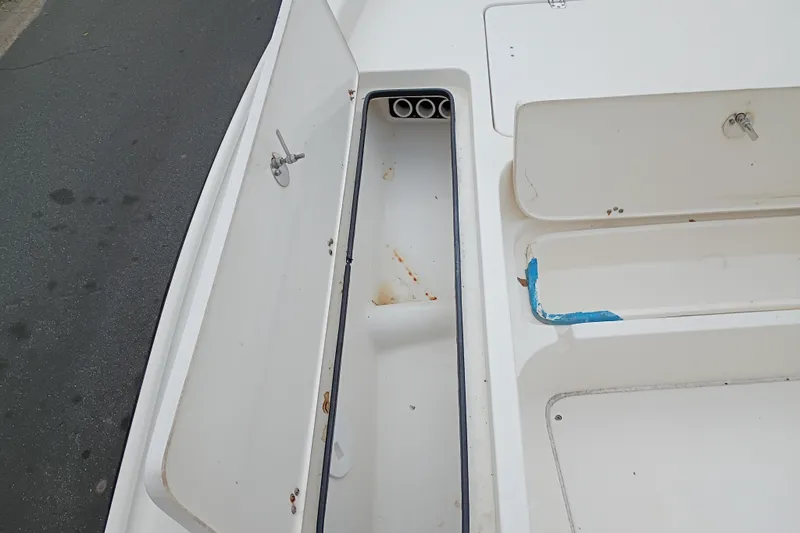 Slide: The Image of Open storage compartments on a 2006 ShearWater Z2200 boat deck. - 41