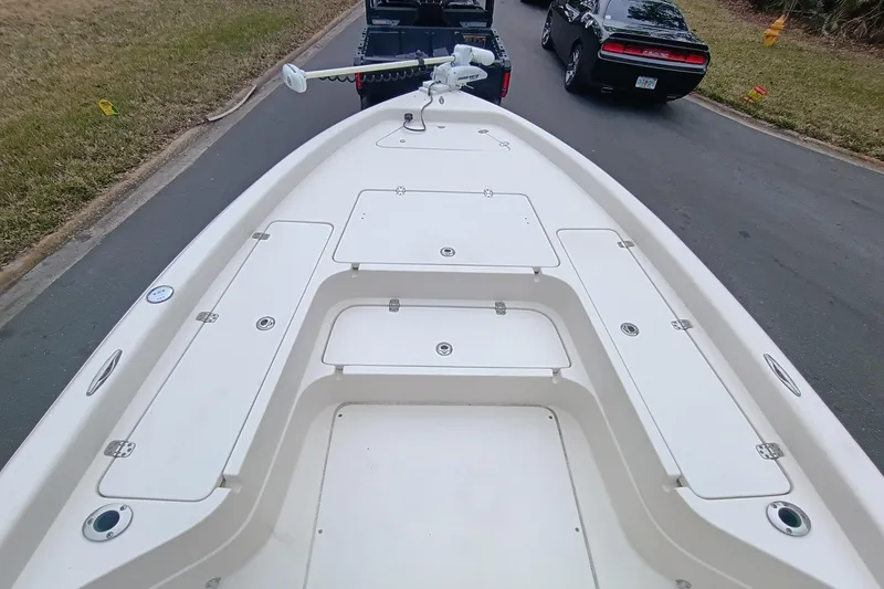 Slide: The Image of 2006 ShearWater Z2200 boat deck with storage compartments, parked on a street. - 43