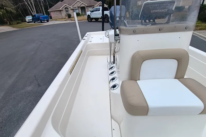 Slide: The Image of 2006 ShearWater Z2200 boat interior with seating and Lowrance equipment. - 46