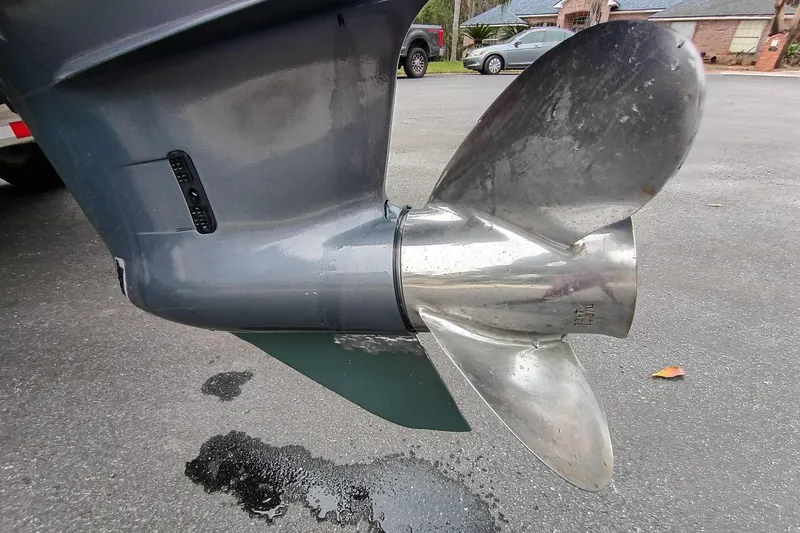 Slide: The Image of Close-up of a ShearWater Z2200 2006 boat propeller on a wet pavement. - 5
