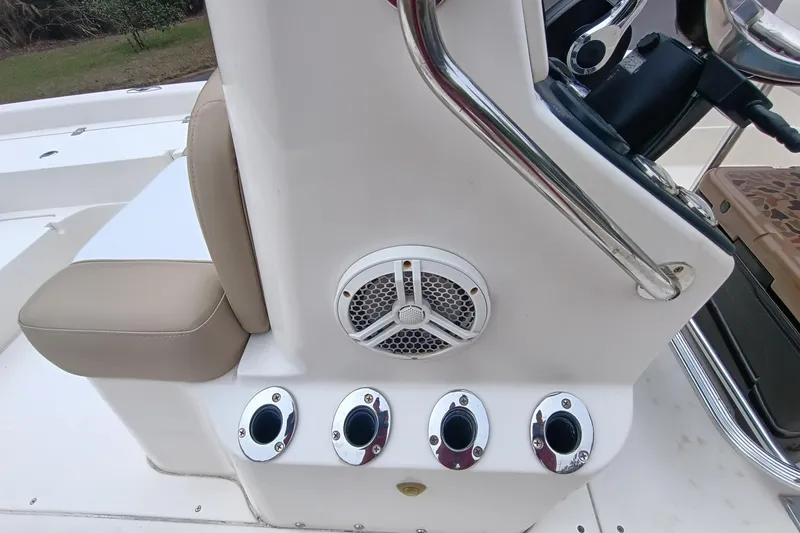 Slide: The Image of 2006 ShearWater Z2200 boat console with speaker and rod holders. - 51