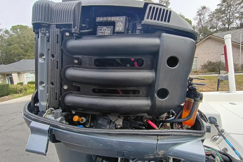 Slide: The Image of Close-up of a 2006 ShearWater Z2200 outboard motor, showcasing engine components. - 8