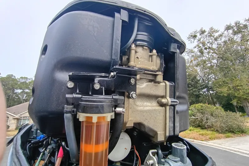 Slide: The Image of Close-up of a 2006 ShearWater Z2200 engine, showcasing mechanical components outdoors. - 9