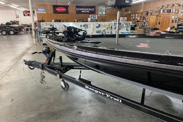 Slide: The Image of 2019 Ranger Z520C Carbon Comanche boat on trailer in showroom. - 4