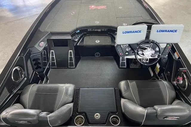 Slide: The Image of 2019 Ranger Z520C Carbon Comanche boat interior with dual Lowrance displays and leather seats. - 7