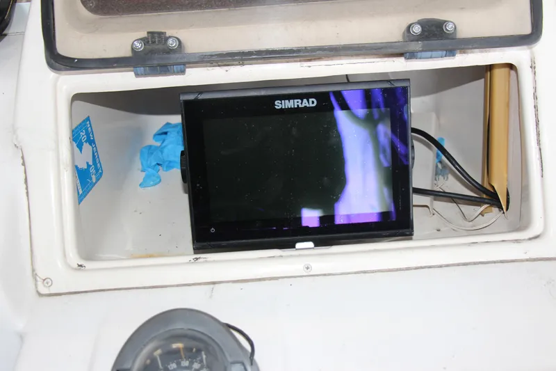Slide: The Image of Simrad display in Grady-White Adventure 208 boat, 2000 model, with storage compartment. - 4