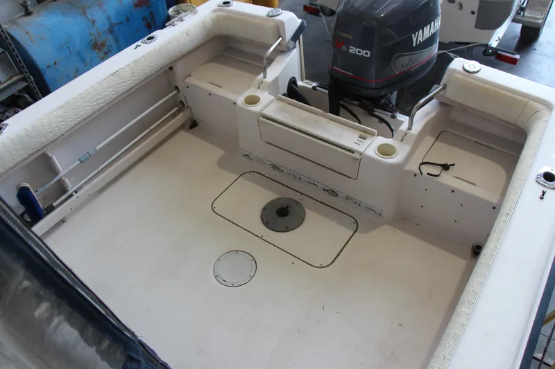 Slide: The Image of 2000 Grady-White Adventure 208 boat interior with Yamaha V6 200 outboard motor. - 6