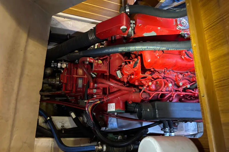 Slide: The Image of 1999 Catalina 380 yacht bathroom with shower, toilet, and small window. - 23