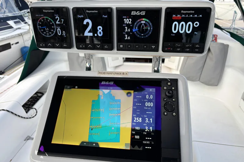 Slide: The Image of 1999 Catalina 380 yacht bathroom with sink, toilet, and mirror. - 25