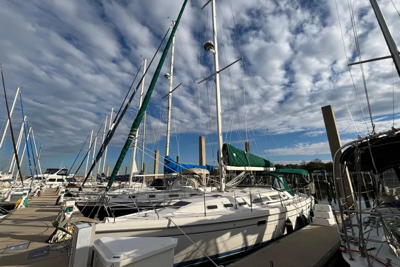 Slide: The Image of Bathroom interior of 1999 Catalina 380 sailboat with sink, mirror, and toilet. - 29