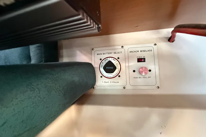 Slide: The Image of Control panel of a 1999 Catalina 380 sailboat with battery selector and anchor windlass. - 51