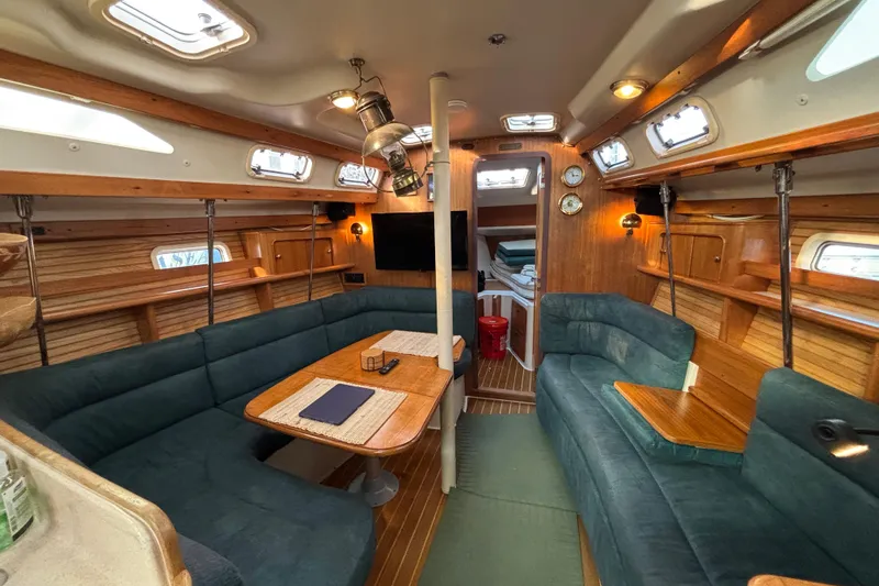 Slide: The Image of Compass and throttle controls on a 1999 Catalina 380 sailboat cockpit. - 8