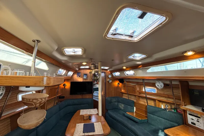 Slide: The Image of Catalina 380 sailboat anchor at marina, 1999 model, docked with other boats. - 9