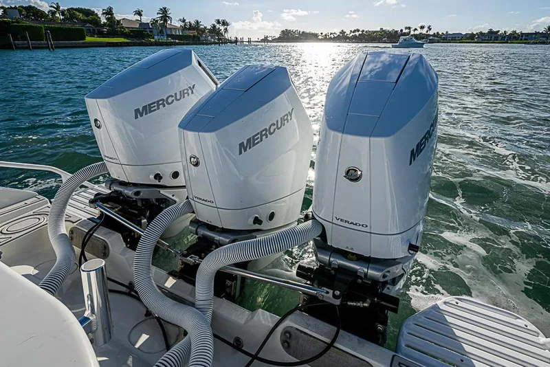 Slide: The Image of 2011 Yellowfin 39 Offshore boat with triple Mercury Verado engines on water. - 25