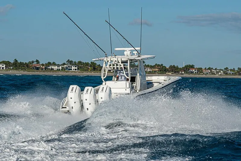 Slide: The Image of 2011 Yellowfin 39 Offshore boat cruising on ocean with powerful engines. - 30