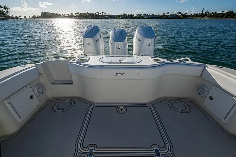 Slide: The Image of 2011 Yellowfin 39 Offshore boat with triple Mercury engines on calm water. - 24