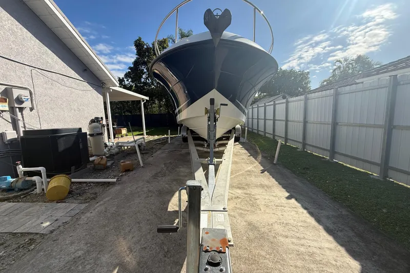 Slide: The Image of 2007 Hydra-Sports Vector 2900 VX boat on trailer, parked beside a house. - 10