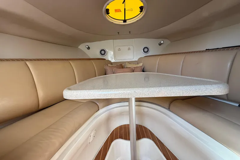 Slide: The Image of 2007 Hydra-Sports Vector 2900 VX cabin interior with beige seating and table. - 110