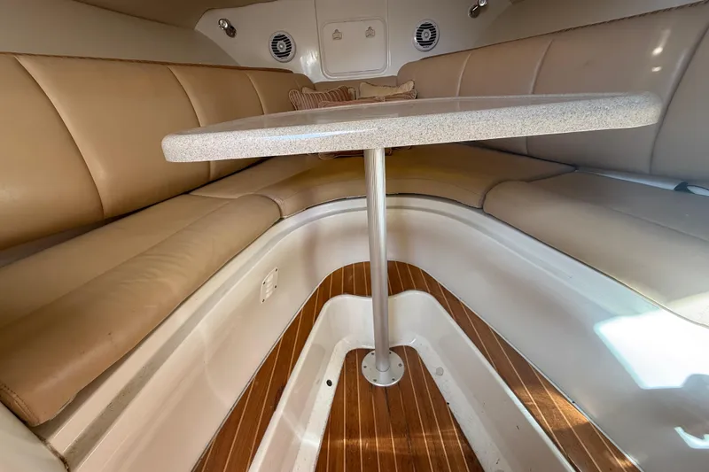 Slide: The Image of 2007 Hydra-Sports Vector 2900 VX cabin interior with beige seating and wooden flooring. - 111