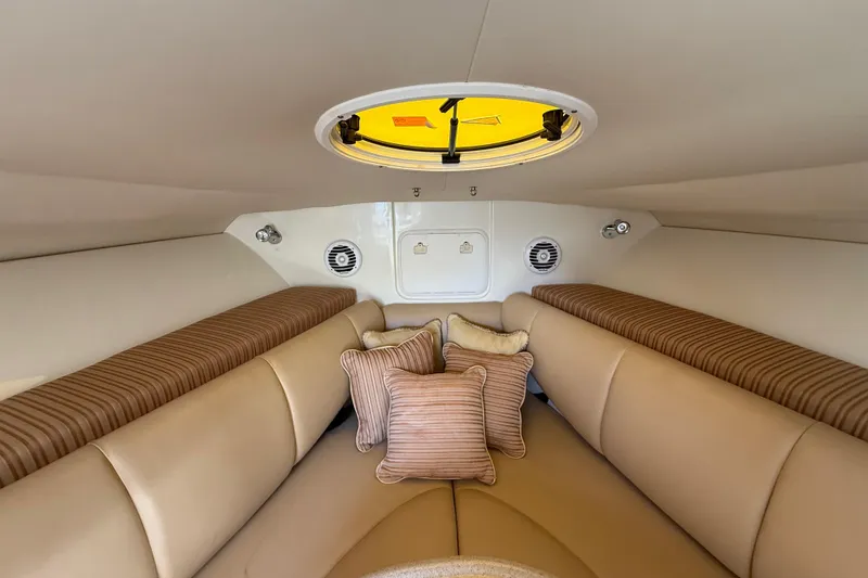 Slide: The Image of 2007 Hydra-Sports Vector 2900 VX cabin interior with beige seating and striped cushions. - 113