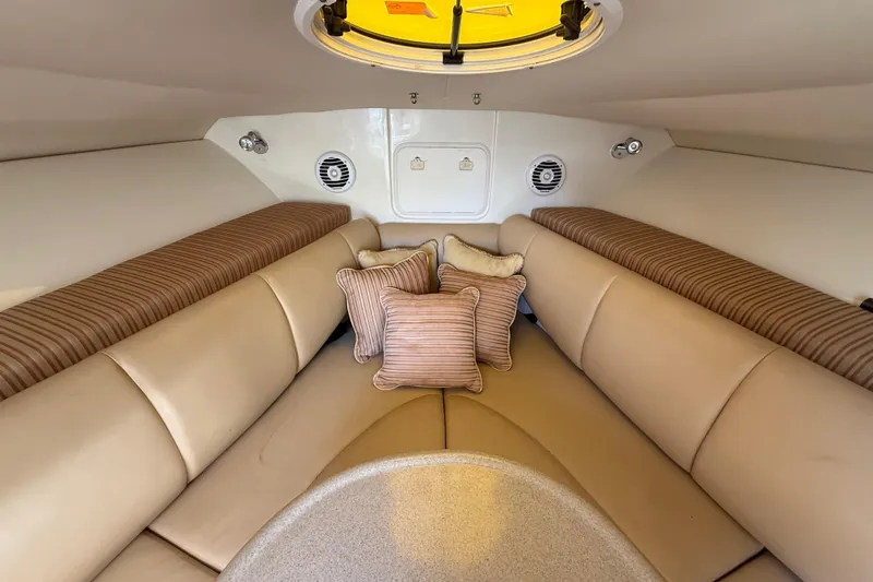 Slide: The Image of 2007 Hydra-Sports Vector 2900 VX cabin interior with beige seating and striped cushions. - 114