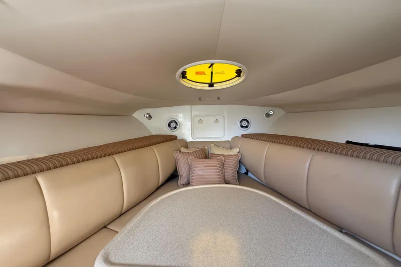 Slide: The Image of 2007 Hydra-Sports Vector 2900 VX cabin interior with beige seating and round hatch. - 115