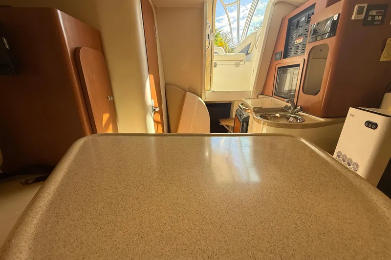 Slide: The Image of 2007 Hydra-Sports Vector 2900 VX cabin interior with kitchenette and seating area. - 120